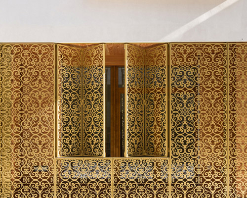 AAVP covers parisian building in golden sheets, carved like iron-worked balconies