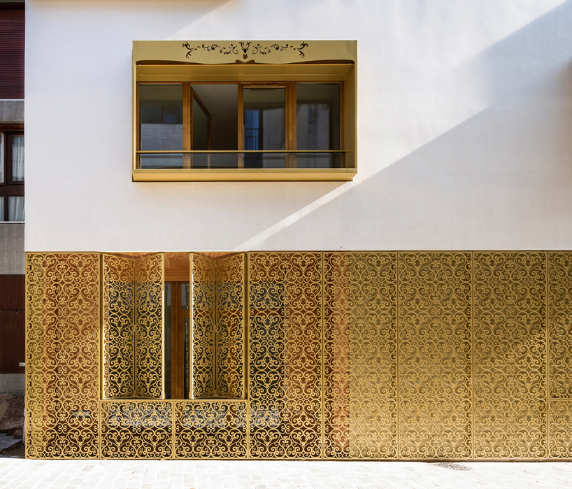 AAVP covers parisian building in golden sheets, carved like iron-worked balconies