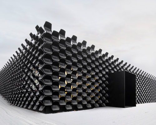 CHYBIK + KRISTOF installs façade made of chairs for furniture pavilion