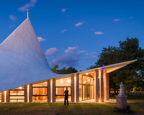 federico ochoa constructs rhomboidal chapel in argentina using domestic materials