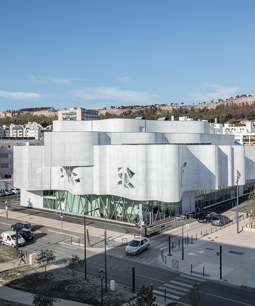 jean-pierre lott wraps vitrolles media library in france with rippling concrete façade