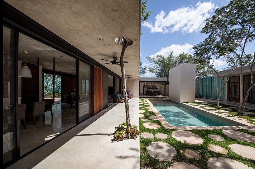 taller estilo blends nature and architecture in mexican house
