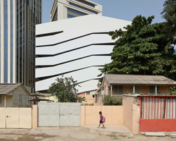 COSTALOPES creates polyhedral white volume for educational institute in angola 