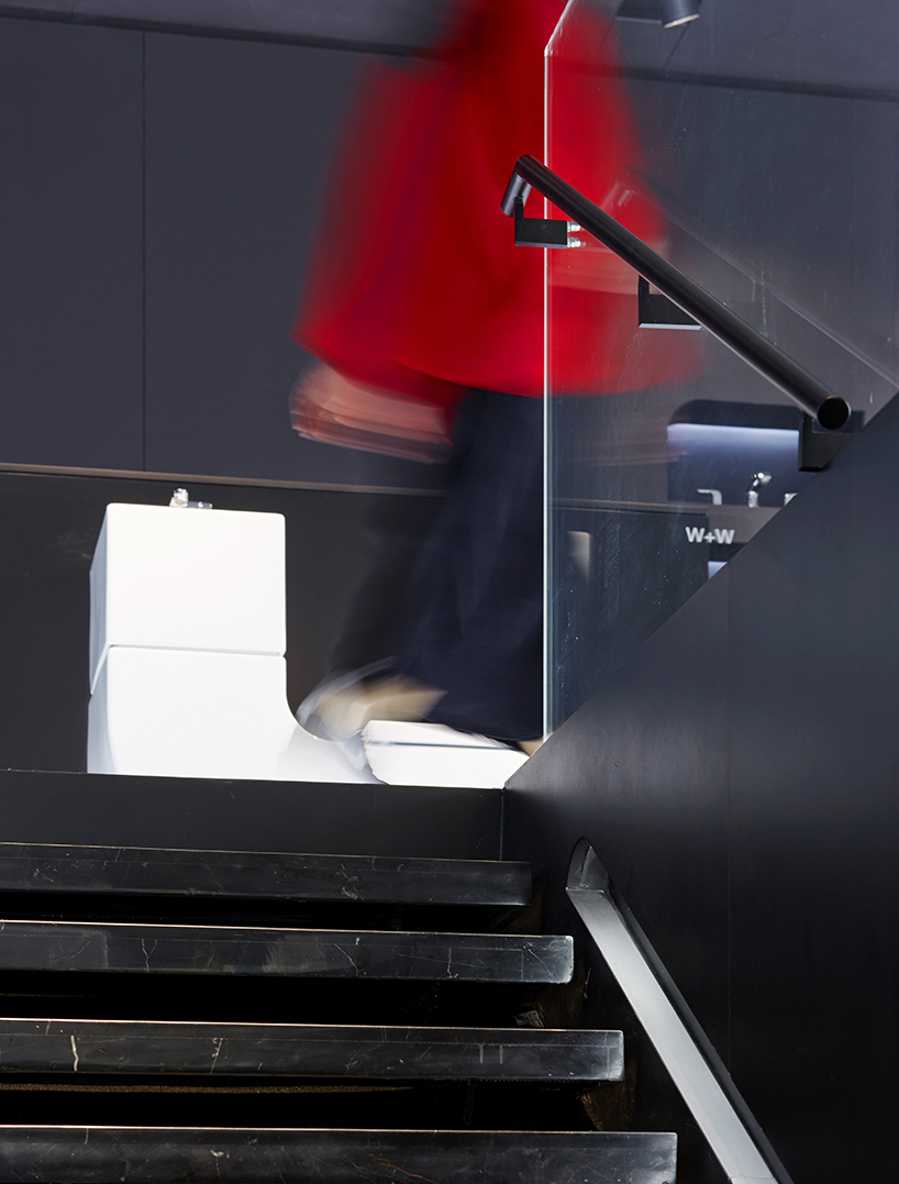 MAD projects simulations of people on LED screens inside roca beijing gallery