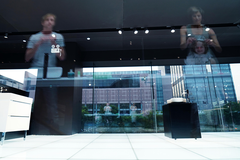 MAD projects simulations of people on LED screens inside roca beijing gallery