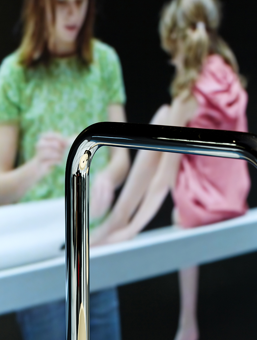 MAD projects simulations of people on LED screens inside roca beijing gallery