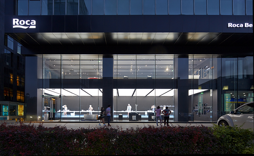 MAD projects simulations of people on LED screens inside roca beijing gallery