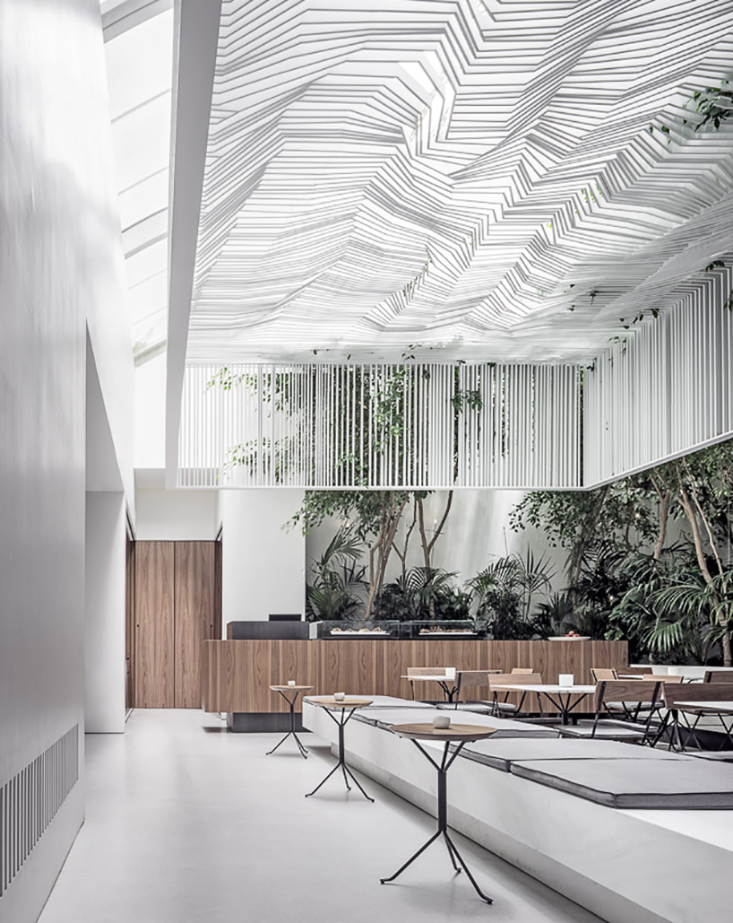 kois associated architects hang sculptural ceiling canopy over museum café in athens