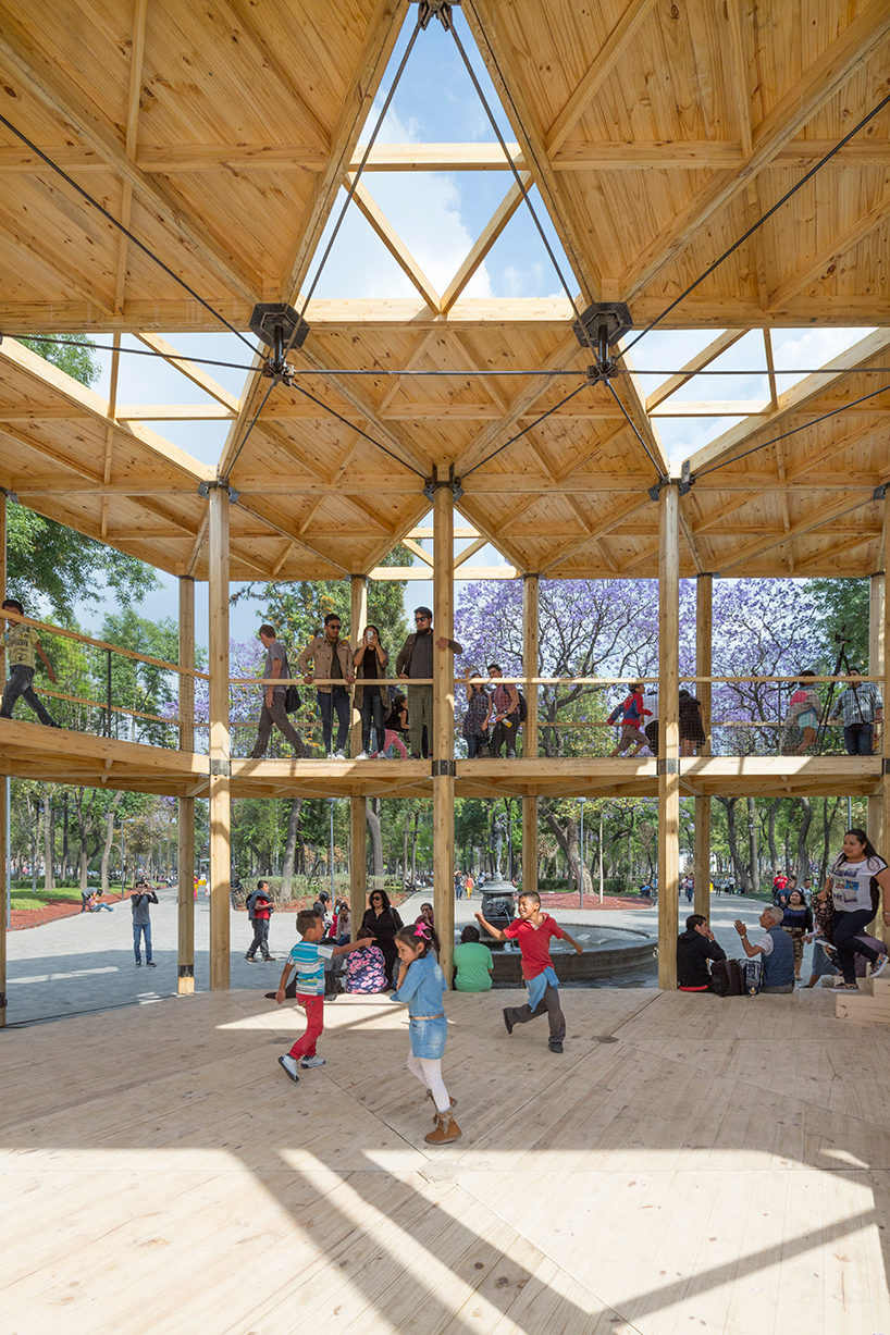 dellekamp arquitectos installs timber pavilion with triangular forms in downtown mexico city