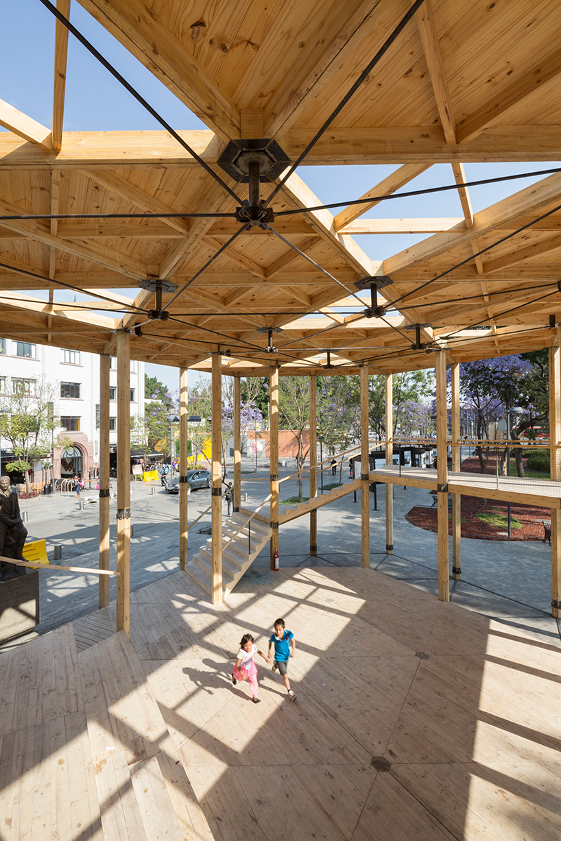 dellekamp arquitectos installs timber pavilion with triangular forms in downtown mexico city