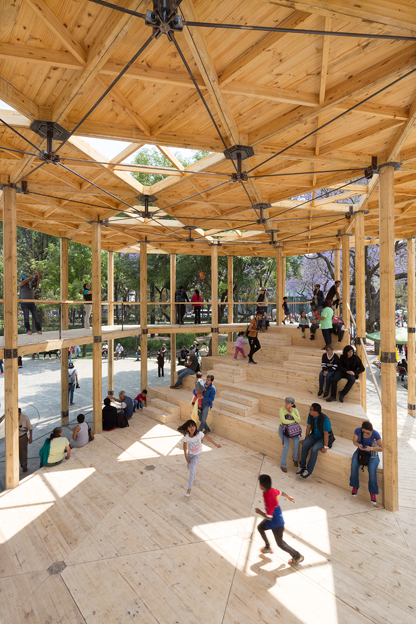 dellekamp arquitectos installs timber pavilion with triangular forms in downtown mexico city