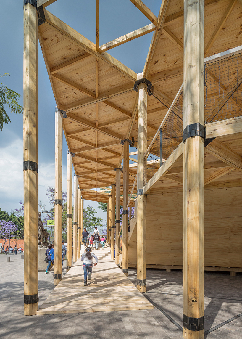 dellekamp arquitectos installs timber pavilion with triangular forms in downtown mexico city