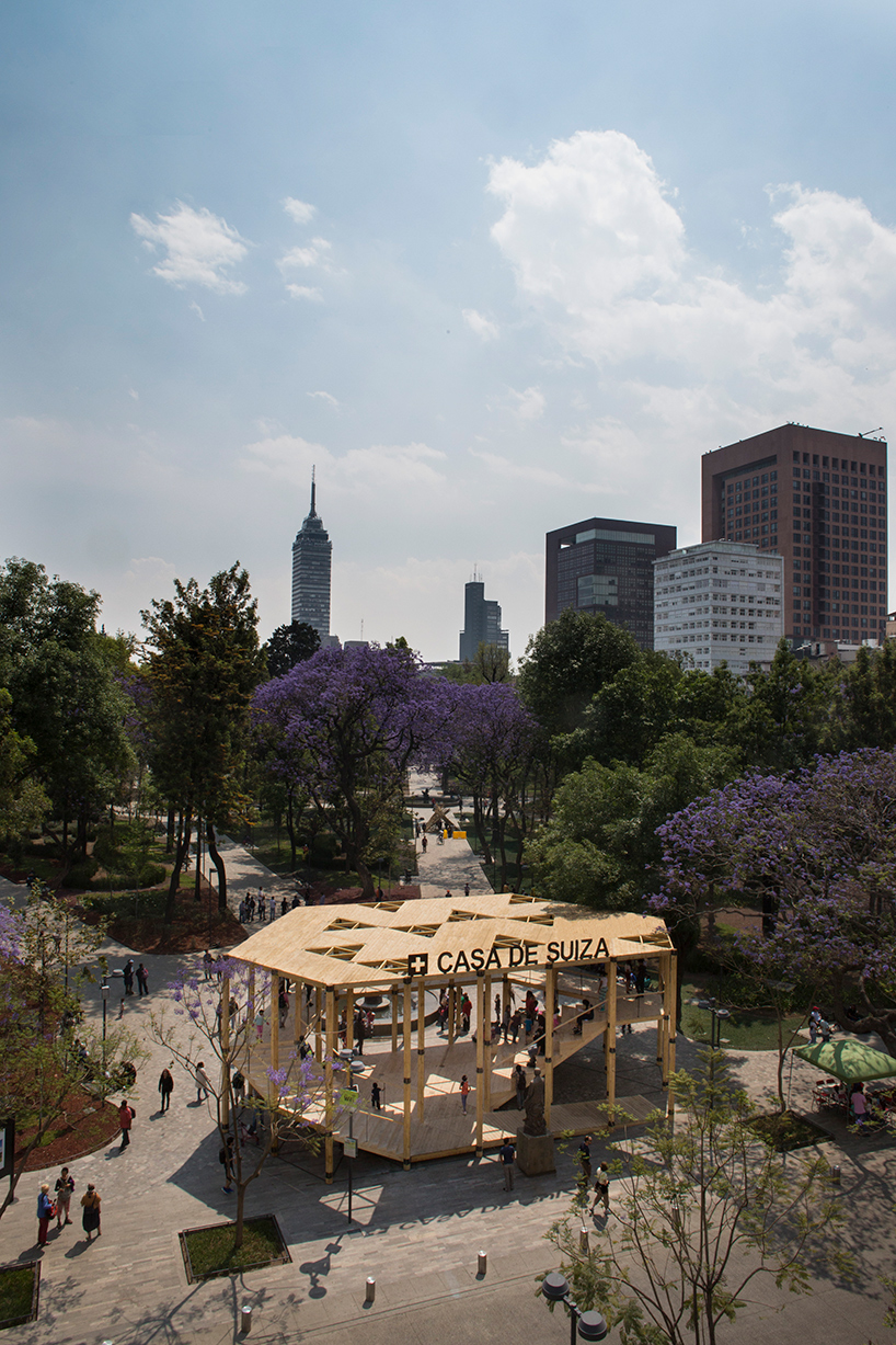 dellekamp arquitectos installs timber pavilion with triangular forms in downtown mexico city