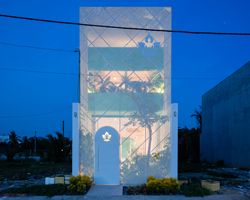 HA's vietnamese 'less house' combines compact urban living with the serenity of nature