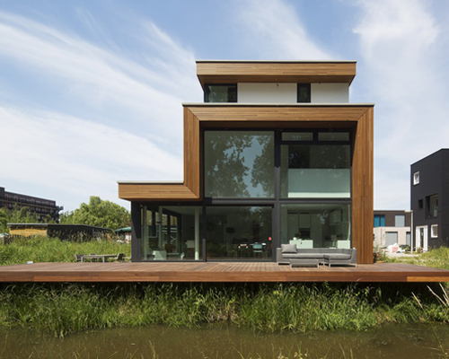 HOYT architecten shapes villa with giant double-height glazings in hague