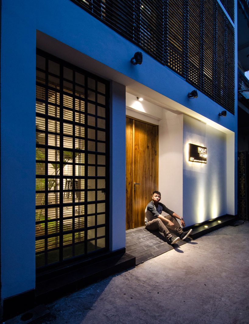 global architects realizes vertical four-storey vacation home in hanoi