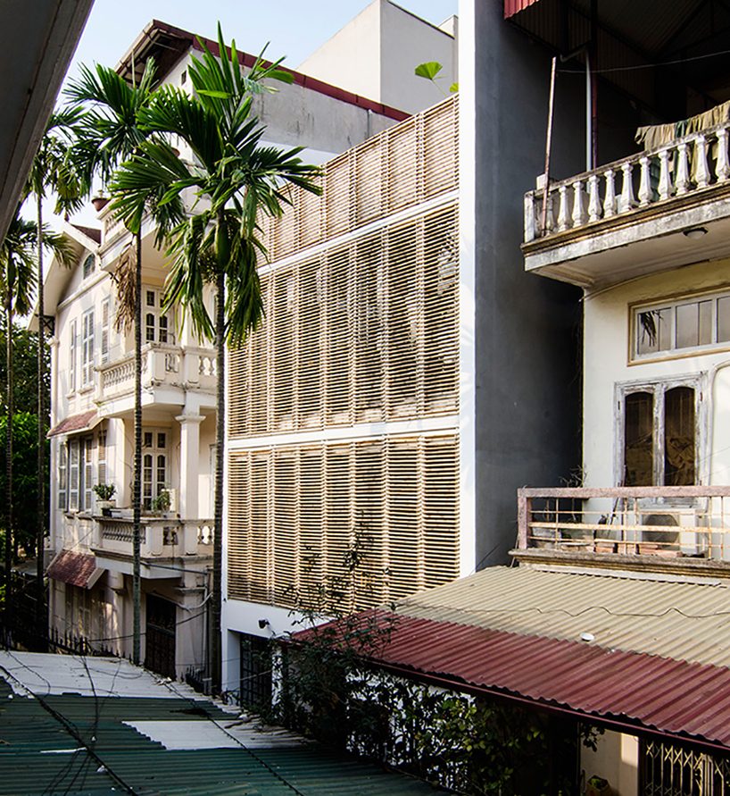 global architects realizes vertical four-storey vacation home in hanoi