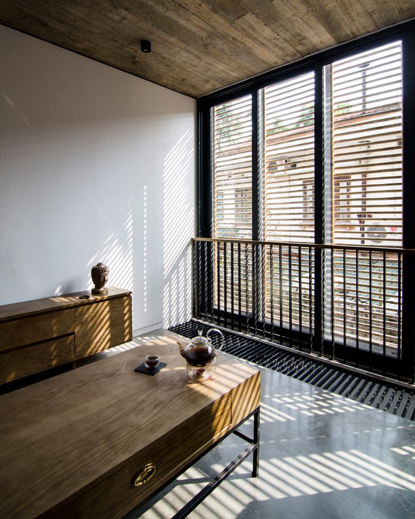 global architects realizes vertical four-storey vacation home in hanoi