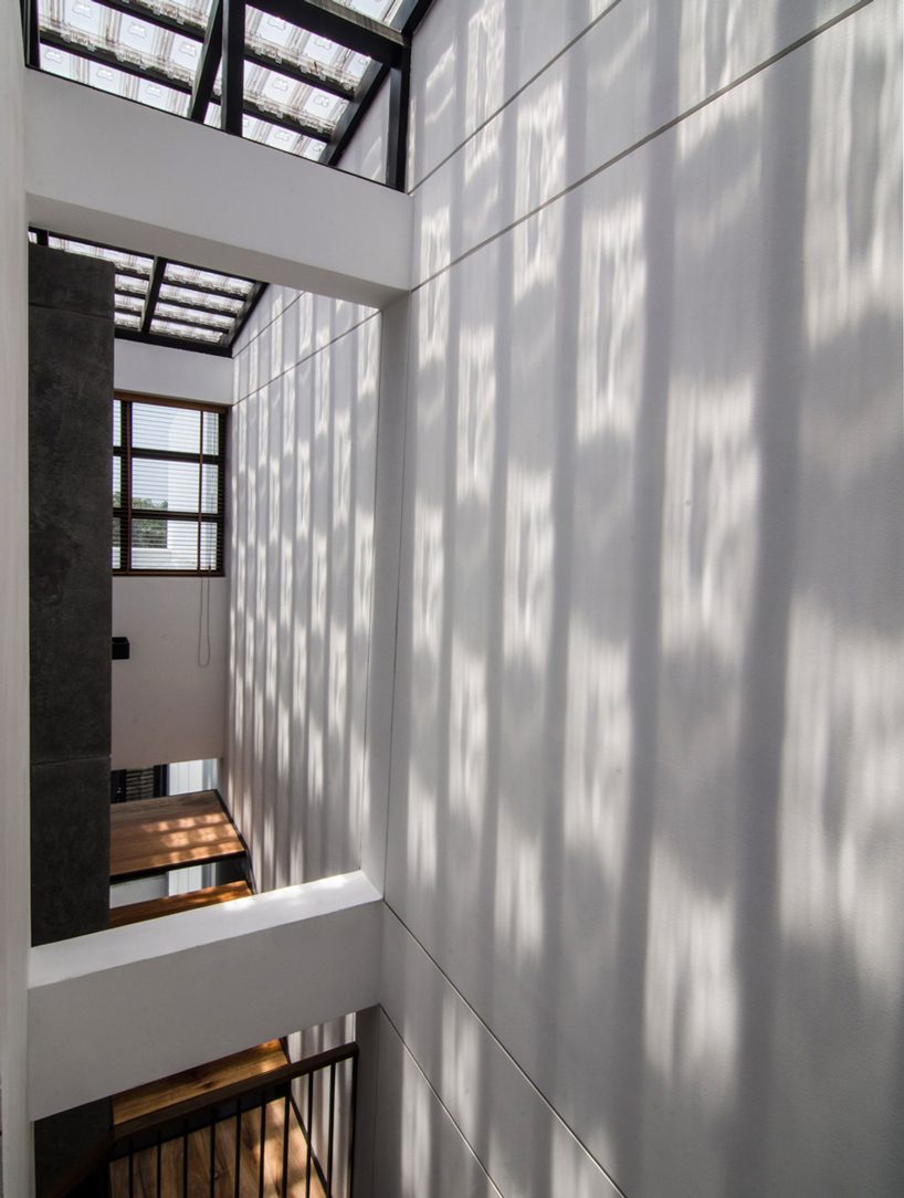 global architects realizes vertical four-storey vacation home in hanoi