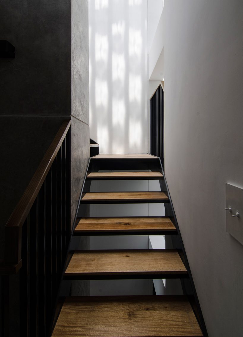 global architects realizes vertical four-storey vacation home in hanoi