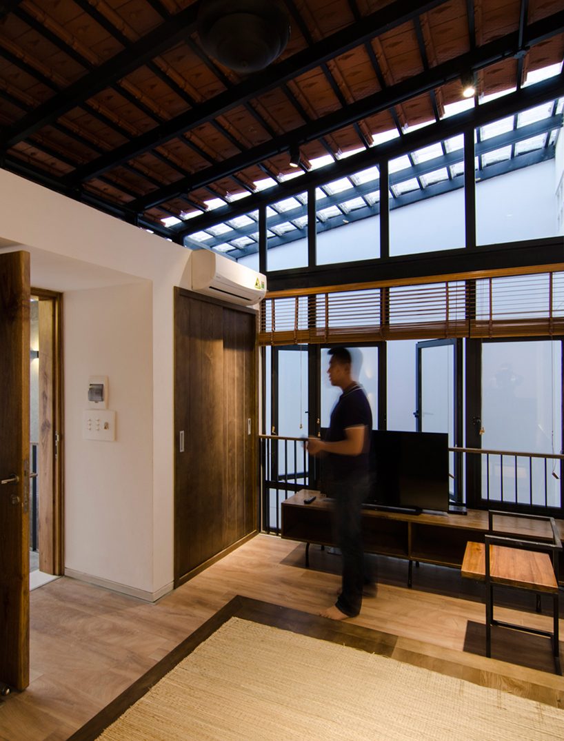 global architects realizes vertical four-storey vacation home in hanoi