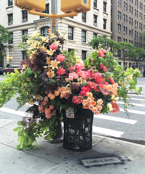 floral designer transforms NYC trash cans into bountiful bin bouquets