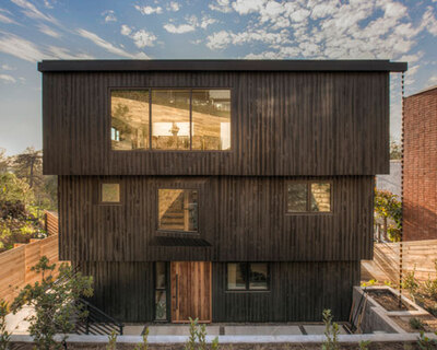 stepped cedar-clad home by the LADG references breuer's former whitney museum