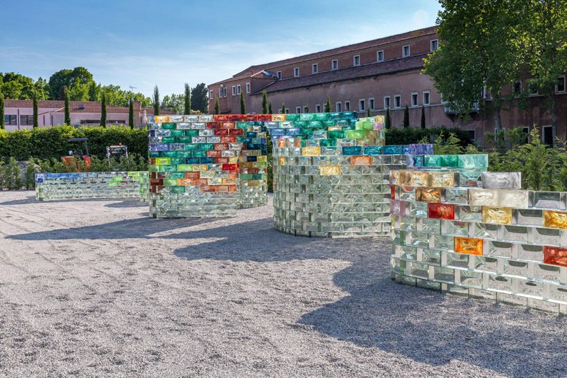 pae white creates a curving wall of colored glass for le stanze del vetro