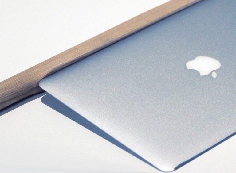 shimabuku's sharpened macbook air cuts an apple at the venice art biennale