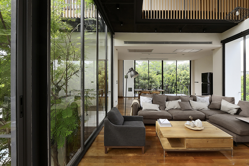 Stu/D/O architects carves openings throughout the façade of bangkok house