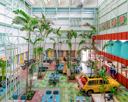 taller KEN populates madero café in guatemala with tropical planting and vintage cars