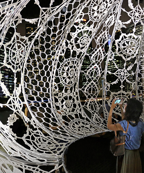 CHOI+SHINE installs hovering, hand crocheted urchins at marina bay, singapore