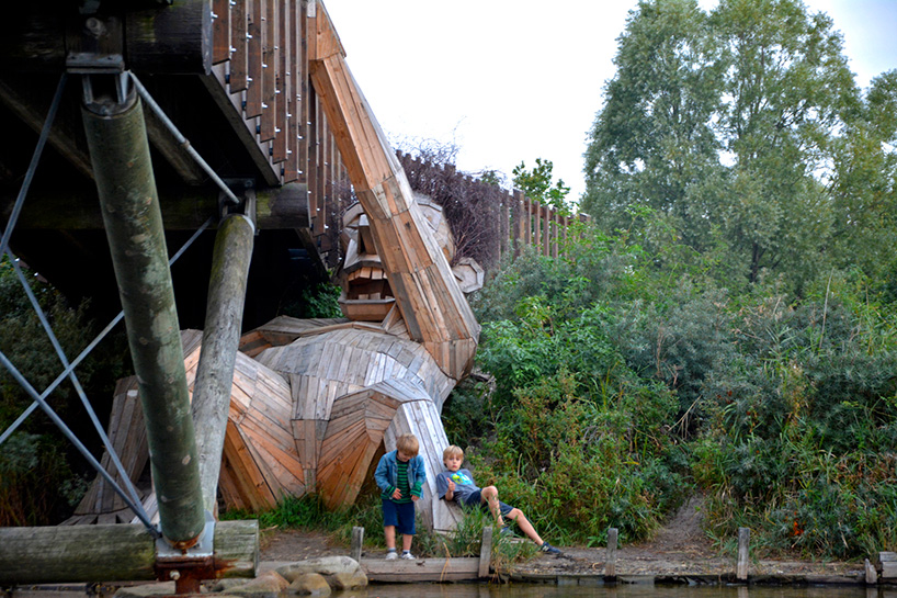 thomas dambo hides six 'forgotten giants' across the danish woodland