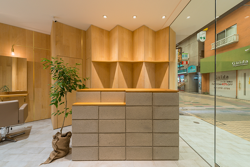 yamazaki kentaro uses rhythmic wooden walls in tokyo hair salon