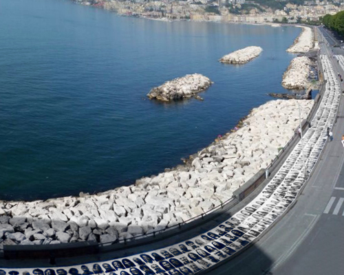3,000 portraits wrap the coast of naples for JR's italian 'inside out' project