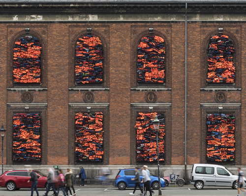 ai weiwei crams 3,500 refugee life jackets into kunsthal charlottenborg's windows