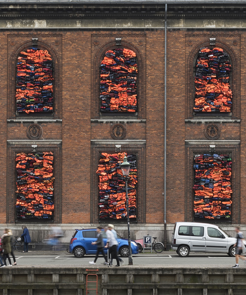 ai weiwei crams 3,500 refugee life jackets into kunsthal charlottenborg's windows