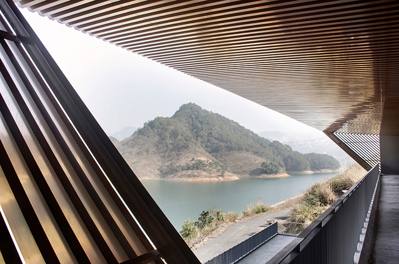 archi-union's cable car station frames the natural vista of the qiandao lake