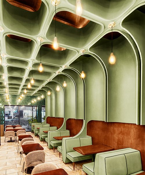 bluarch wraps times square diner with soft green interior in new york