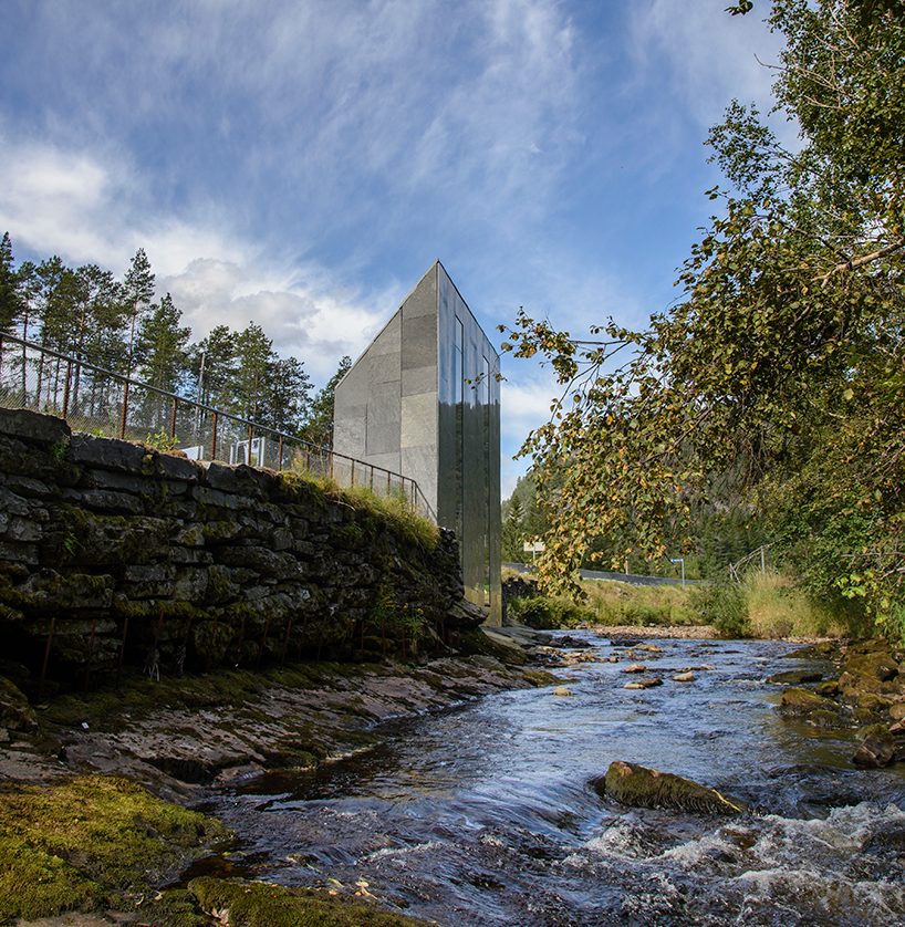 fortunen AS carves sculptural service center from stone in norway