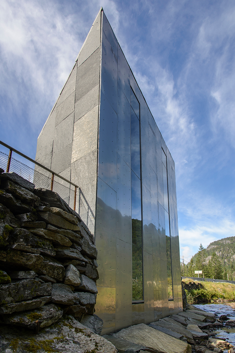 fortunen AS carves sculptural service center from stone in norway