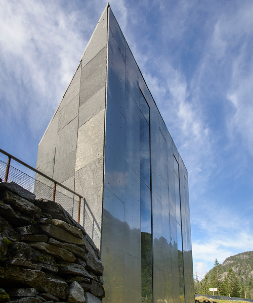 fortunen AS carves sculptural service center from stone in norway