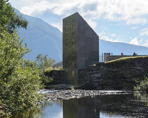 fortunen AS carves sculptural service center from stone in norway