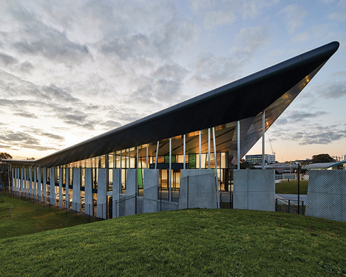 gray puksand tilts butterfly roof for peters ice cream's HQ in melbourne