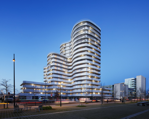hamonic + masson experiments with style to create the undulating new'r tower in nantes