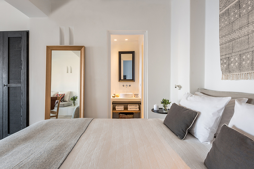 interior design laboratorium renovates scenic suites in santorini getaway