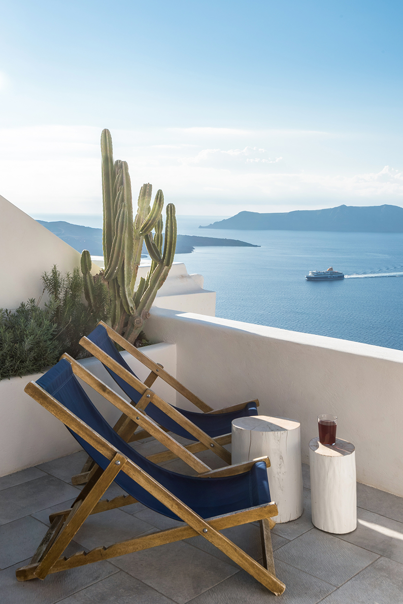 interior design laboratorium renovates scenic suites in santorini getaway