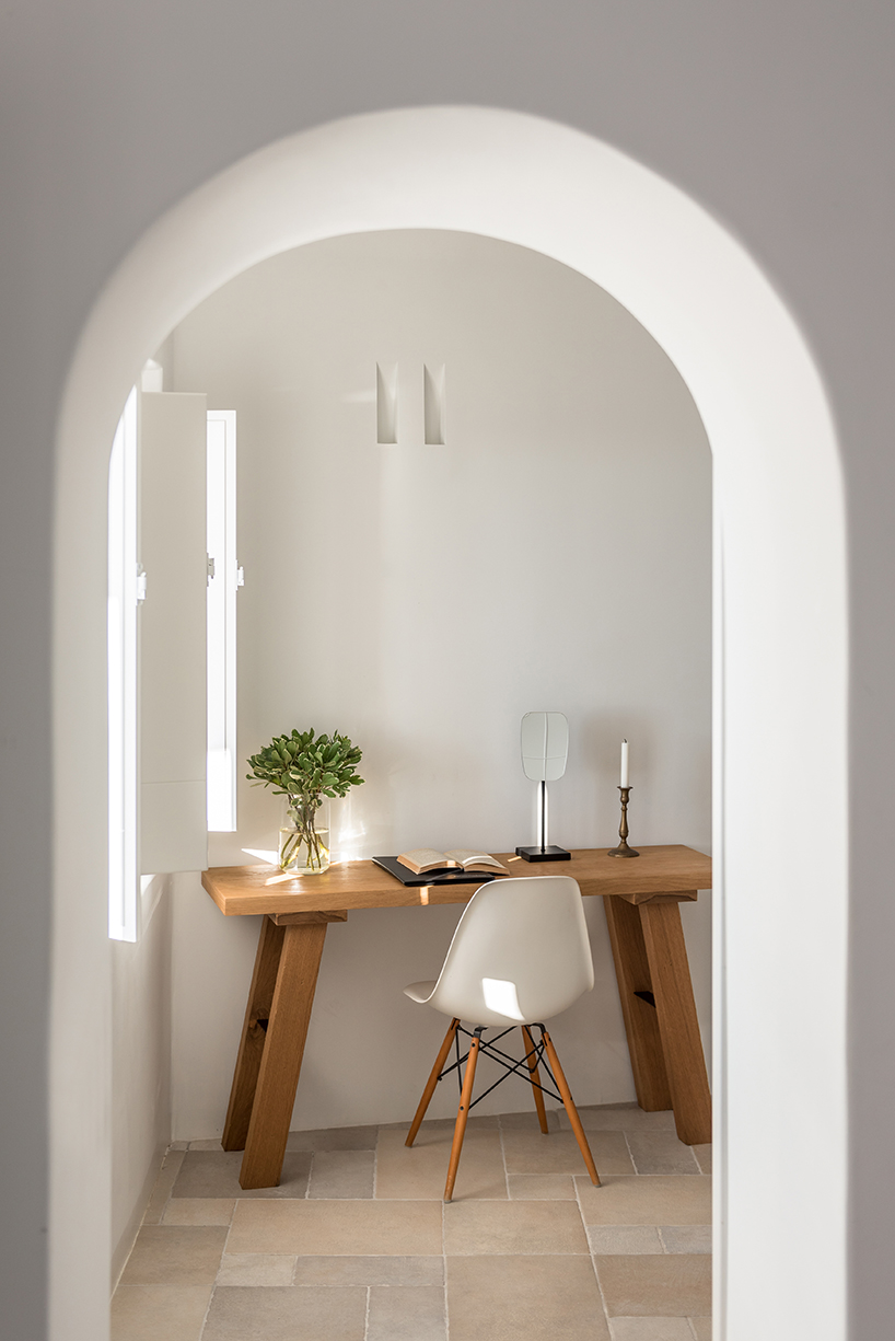 interior design laboratorium renovates scenic suites in santorini getaway
