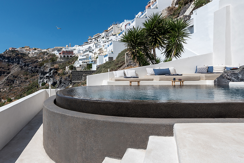interior design laboratorium renovates scenic suites in santorini getaway