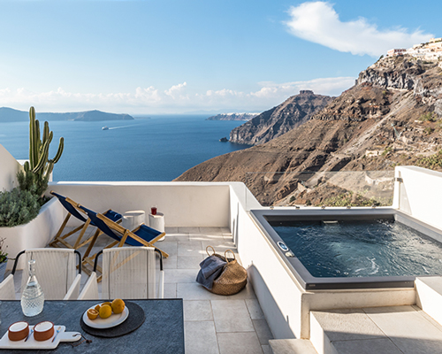 interior design laboratorium renovates scenic suites in santorini getaway